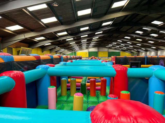 Giant indoor inflatable obstacle course at Holmside Park
